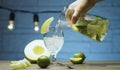 Pouring melon lemonade into a glass Royalty Free Stock Photo