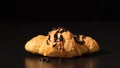 Freshly baked croissant with chocolate sauce