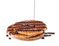 Pouring melted chocolate onto waffles isolated on white Royalty Free Stock Photo