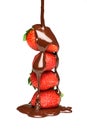 Pouring melted chocolate over strawberries Royalty Free Stock Photo