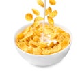 Pouring milk into bowl with corn flakes on background. Breakfast cereal Royalty Free Stock Photo