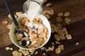 Pouring milk into breakfast cereal cornflakes Royalty Free Stock Photo