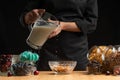 Pouring milk into the breakfast, freezing in motion. Cooking breakfast cereals, granules, breakfast cereals, cereals, berries of Royalty Free Stock Photo