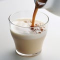 Pouring milk chocolate into a glass Royalty Free Stock Photo