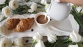 Pouring milk into coffee cup close up