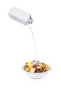 Pouring milk into cornflakes bowl Royalty Free Stock Photo