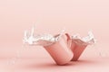 Pouring milk into a cup, milk splashing in pink cup Royalty Free Stock Photo