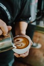 Pouring milk for making latte art coffee Royalty Free Stock Photo