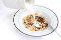 Pouring milk on muesli Royalty Free Stock Photo