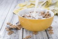 Pouring Milk on a portion of Cornflakes