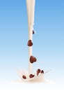 Pouring milk splash with chocolate heart candies Royalty Free Stock Photo