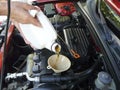 Pouring Motor Oil