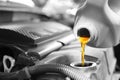 Pouring oil into car engine Royalty Free Stock Photo