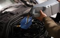 Pouring oil into car engine closeup. Changing oil in engine and gearbox Royalty Free Stock Photo