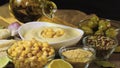 Pouring olive oil in Chickpea hummus made from mashed chickpeas dip with tahini lemon garlic close-up. Enjoying yummy hummus with Royalty Free Stock Photo