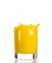 Pouring orange juice into a transparent glass on a white background Royalty Free Stock Photo