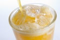 Pouring Orangeade Into A Glass Of Ice Royalty Free Stock Photo