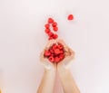 Pouring out a handful of raspberry fruit