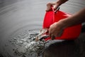 Pouring out small fish from a bucket