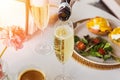 Pouring prosecco sparkling wine in a glass on sunday brunch Royalty Free Stock Photo