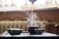 Pouring of Puer Tea from Teapot at Traditional Chinese Tea Ceremony. Set of Equipment for Drinking Tea