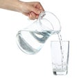 Pouring purified fresh water from the jug in glass, isolated on background Royalty Free Stock Photo