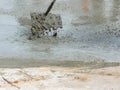 Pouring ready-mixed concrete after placing steel reinforcement to make the road Royalty Free Stock Photo