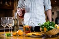 Pouring red wine into a carafe Royalty Free Stock Photo