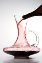 Pouring red wine into decanter