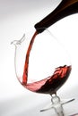 Pouring red wine into decanter Royalty Free Stock Photo