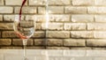 Pouring red wine into a glass against a white brick wall background,warm shades,close-up Royalty Free Stock Photo