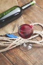 Pouring red wine glass against wooden background Royalty Free Stock Photo