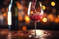 Pouring red wine into the glass. Bar interior in blurred background Royalty Free Stock Photo