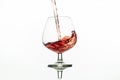 Pouring red wine into glass from bottle Royalty Free Stock Photo