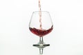 Pouring red wine into glass from bottle Royalty Free Stock Photo