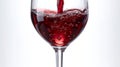Pouring red wine into a glass with splashes on a white background. AI Generated. Royalty Free Stock Photo