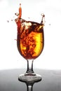 Pouring red wine into a glass of yellow water Royalty Free Stock Photo