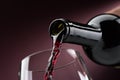 Pouring red wine into a wineglass Royalty Free Stock Photo