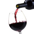 Pouring red wine into a wineglass Royalty Free Stock Photo