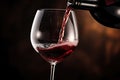 Pouring red wine into wineglass on dark background, closeup, hand Pouring red wine into a wine glass. close up, AI Generated Royalty Free Stock Photo