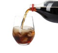 Pouring refreshing cola into glass with ice cubes on white background Royalty Free Stock Photo