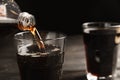 Pouring refreshing soda drink into glass on table. Space for text Royalty Free Stock Photo