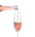 Pouring rose champagne from bottle into glass Royalty Free Stock Photo