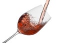 Pouring rose wine into glass isolated on white Royalty Free Stock Photo