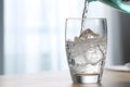 Pouring soda water from bottle into glass Royalty Free Stock Photo