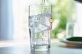 Pouring soda water from bottle into glass Royalty Free Stock Photo