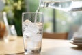 Pouring soda water from bottle into glass Royalty Free Stock Photo