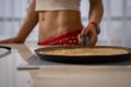 Pouring spinach pancake batter to frying pan Royalty Free Stock Photo