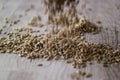 Pouring Sunflower Seeds on a white wooden surface. Royalty Free Stock Photo