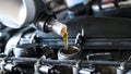 Close up of pouring synthetic motor oil in diesel engine Royalty Free Stock Photo